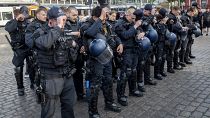 Policemen in Mannheim pay tribute to their colleague after a deadly stabbing in Mannheim, Germany