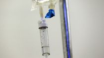 Chemotherapy drugs are administered to a patient at a hospital