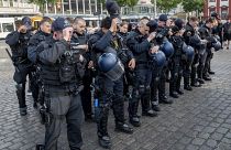 Policemen in Mannheim pay tribute to their colleague after a deadly stabbing in Mannheim, Germany