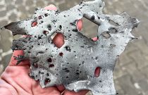 The metal fragment found at a bus stop hit by a missile demonstrates the destructive power of such missiles