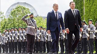 German Chancellor Olaf Scholz, centre, and Portugal's Prime Minister Luis Montenegro walk during their meeting at the Federal Chancellery in Berlin, Friday, May 24, 2024.