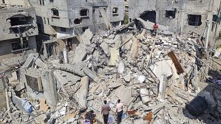 Palestinians look at the destruction after an Israeli airstrike in Rafah, Gaza Strip. Monday, April 29, 2024.