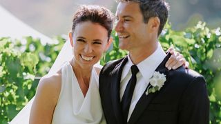 Former New Zealand Prime Minister Jacinda Ardern embraces her husband Clarke Gayford at their wedding in Havelock North, New Zealand on Saturday