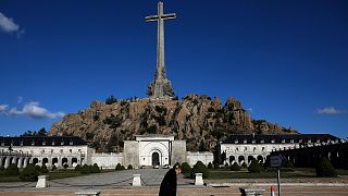 A friar walks in front of the Valle de los Caidos (Valley of the Fallen) mausoleum on the outskirts of Madrid, Spain