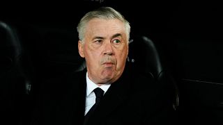 Real Madrid's head coach Carlo Ancelotti takes his seat on the bench ahead of the La Liga soccer match between Valencia and Real Madrid.