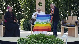 Pope Francis is offered a 'peace flag' during the 'Arena of Peace - Justice and Peace Will Embrace' meeting in Verona, Italy, Saturday, May 18,2 2024.