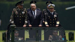 Mexico's President Andres Manuel Lopez Obrador, centre, Defense Secretary Luis Cresencio Sandoval, left, and Naval Commander Jose Rafael Ojeda in Mexico City, August 2021. 