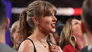 Taylor Swift watches the celebration on the field after the NFL Super Bowl 58 football game between the Kansas City Chiefs and the San Francisco 49ers. Feb. 11, 2024. 