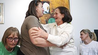 Members of the association Mothers of Srebrenica react to UN Srebrenica ruling, in Potocari, Bosnia, Thursday, May 23, 2024.