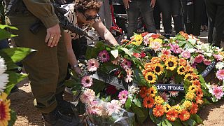 Mourners attend the funeral of Michel Nisenbaum, who was killed during Hamas' Oct. 7 attack and whose body was taken into Gaza, in Ashkelon, Israel, on Sunday, May 26, 2024. 