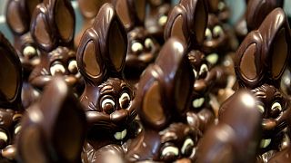 Chocolate rabbits wait to be decorated at the Cocoatree chocolate shop, April 2020, in Lonzee, Belgium.