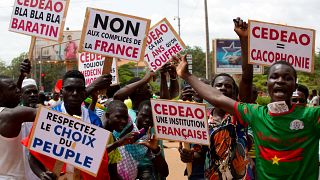 Supporters of military leader Ibrahim Traore protest against France and the West African regional bloc known as ECOWAS in the streets of Ouagadougou, Burkina Faso.