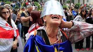 A demonstrator shouts in front of police, during an opposition protest against the foreign influence bill at the Parliamentary building in Tbilisi, Georgia, May 28, 2024