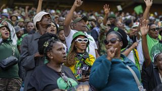 Supporters wait for former South African President Jacob Zuma to arrive at Orlando stadium in the township of Soweto.