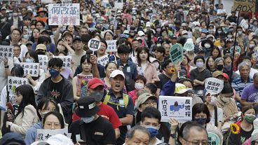 Supporters of the ruling Democratic Progressive Party (DPP) gather in front of the legislative building in Taipei, Taiwan, Tuesday, May 28, 2024.