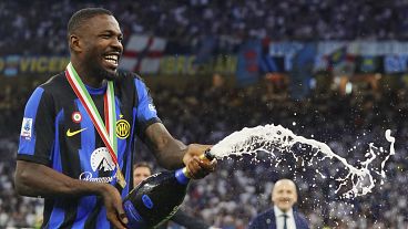 Inter's Marcus Thuram celebrates their victory of the "scudetto" after the Serie A soccer match between Inter and Lazio at the San Siro Stadium in Milan on 19 May 2024