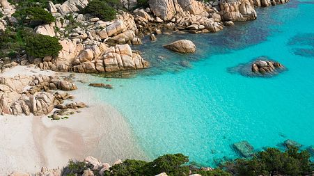 Sardinia is known for its pristine white beaches. But authorities are urging tourists to leave sand and pebbles where they are. 