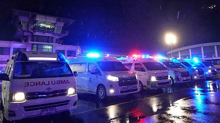 Ambulances wait to carry passengers from a London-Singapore flight that encountered severe turbulence, in Bangkok, Thailand, Tuesday, May 21, 2024. 