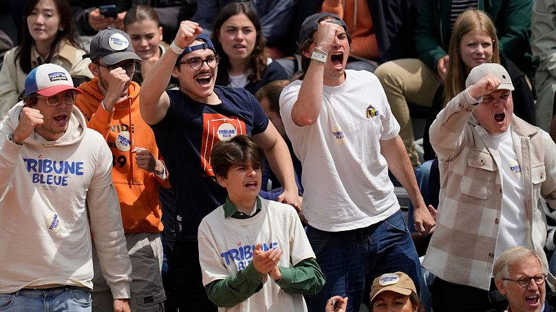 Spectators shout during the French Open tennis tournament at the Roland Garros stadium in Paris - 30 May 2024.